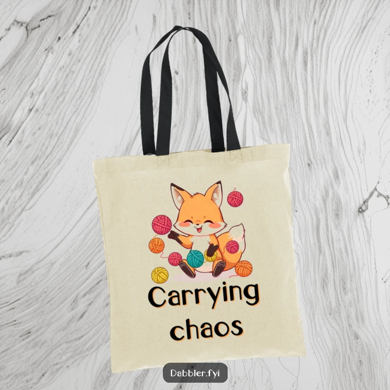 Funny tote bag with a playful fox character juggling colorful yarn balls, perfect for carrying craft supplies.