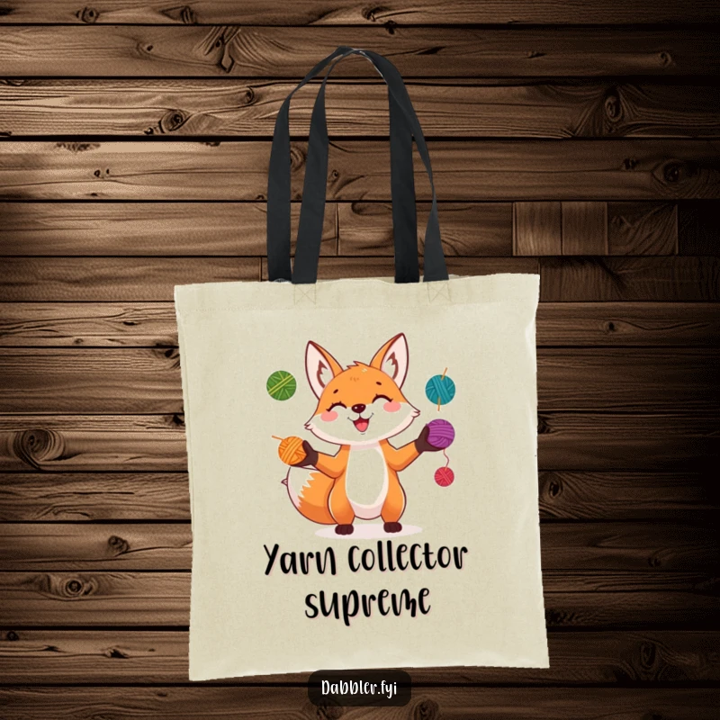 Funny Fox Tote Bag: A playful fox grins while juggling colorful yarn balls, a vibrant and fun accessory for crafters.