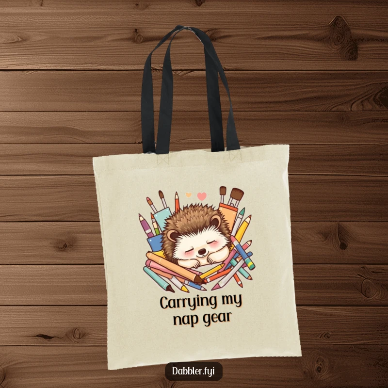 Funny Tote Bag: A contented hedgehog naps peacefully surrounded by colorful art supplies, perfect for carrying creative essentials.